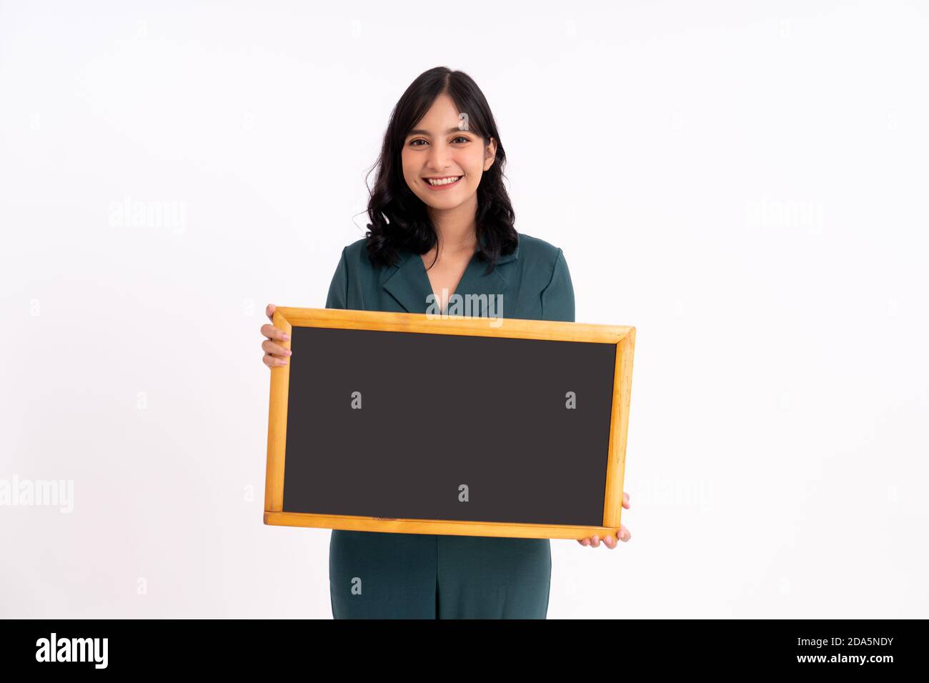 Happy business woman portrait. Showing copy space on the board Stock ...