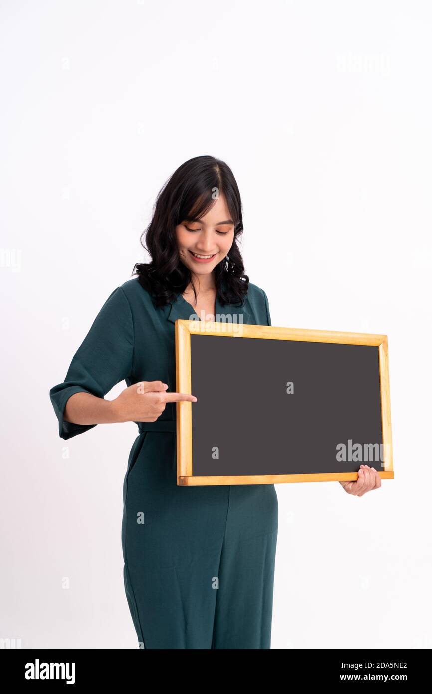 Happy business woman portrait. Showing copy space on the board Stock ...