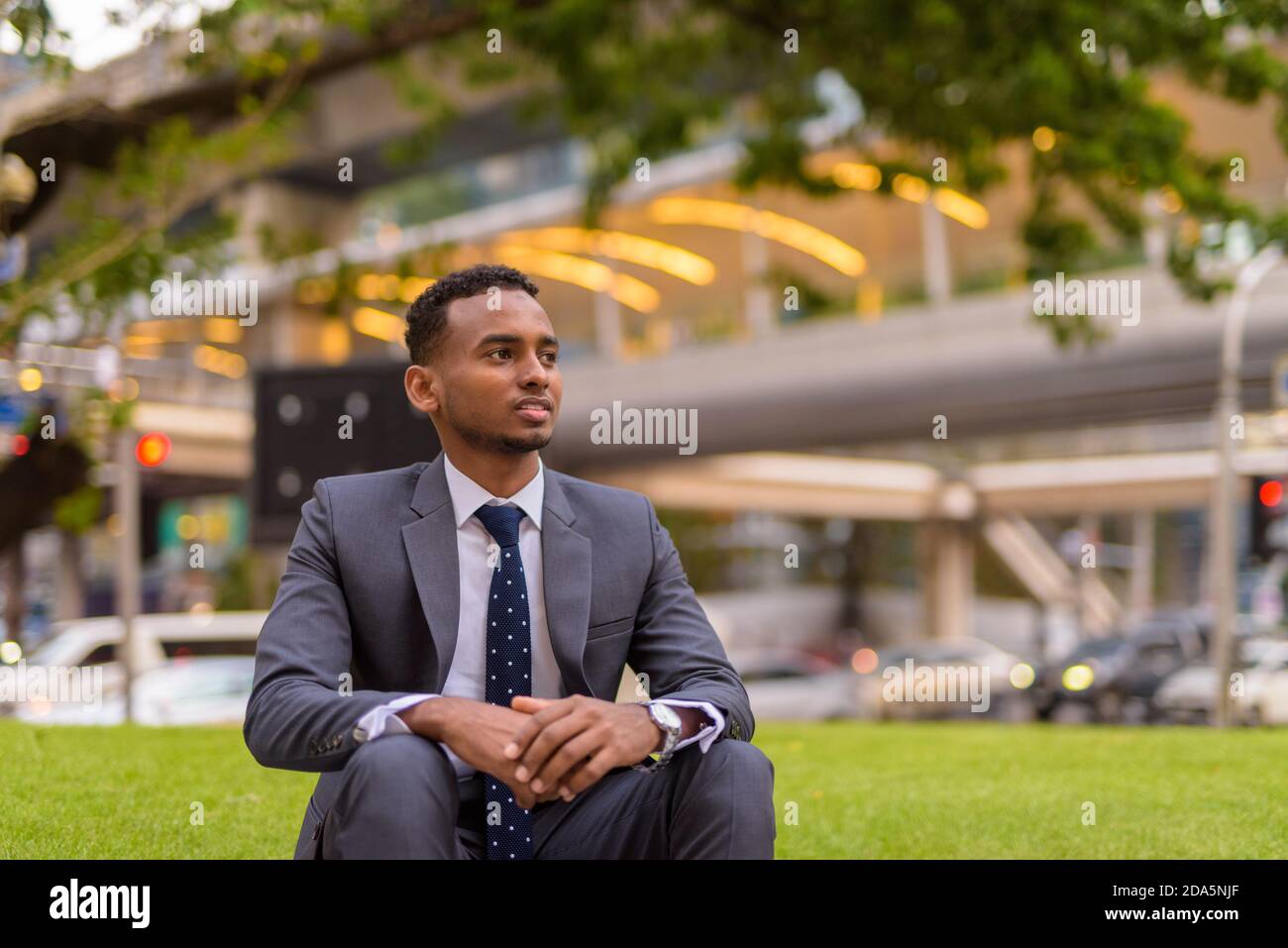 Black guy sitting hi-res stock photography and images - Alamy