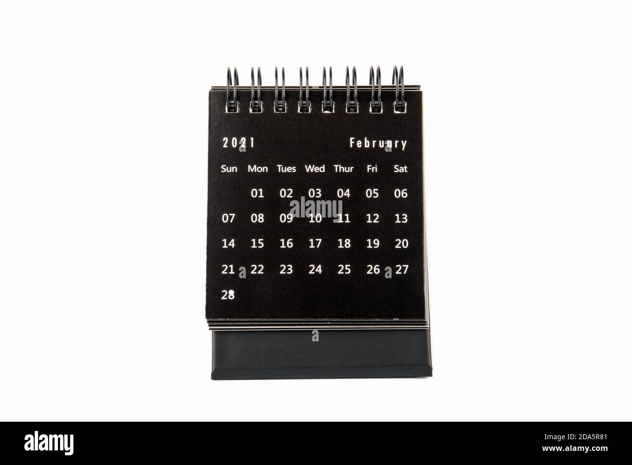 2021 FEBRUARY. Time planning, business, day counting and holidays. Paper calendar on a white table. Stock Photo