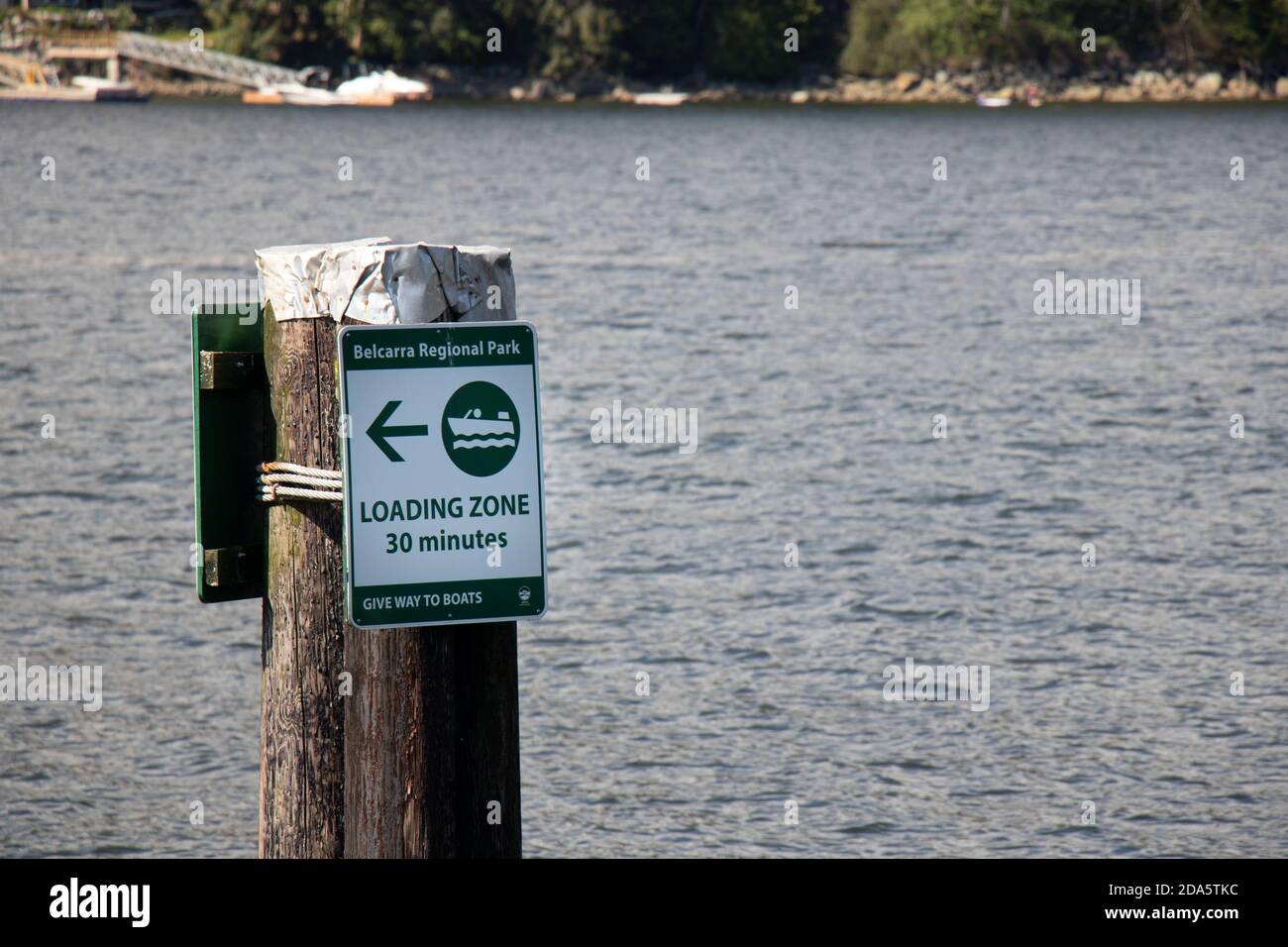 Vancouver, Canada - July 13, 2020: View of sign 'Loading zone 30 minutes' on a pier in Belcarra Regional Park Stock Photo