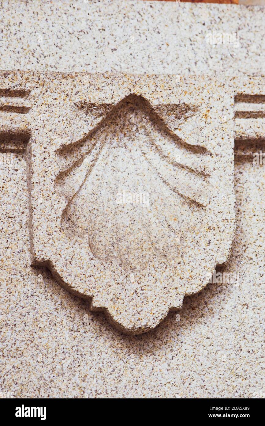 Shell symbol of the way of st james engraved in stone stock photo alamy