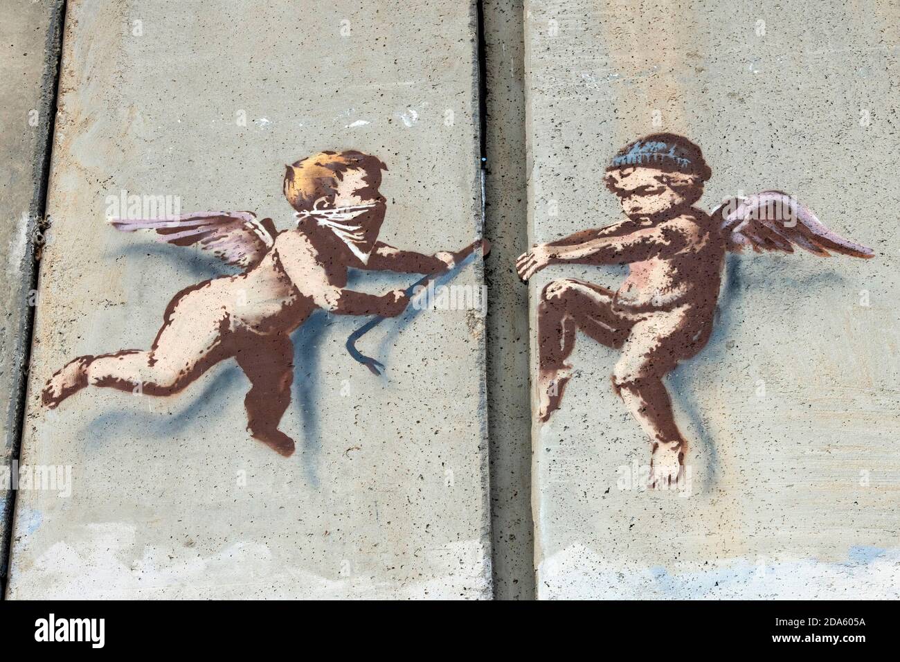 Banksy’s Christmas Messages on demarcation wall between Israel and Palestine “Peace on Earth” and “Cherubs”, on Bethlehem, Palestine 2017 Stock Photo
