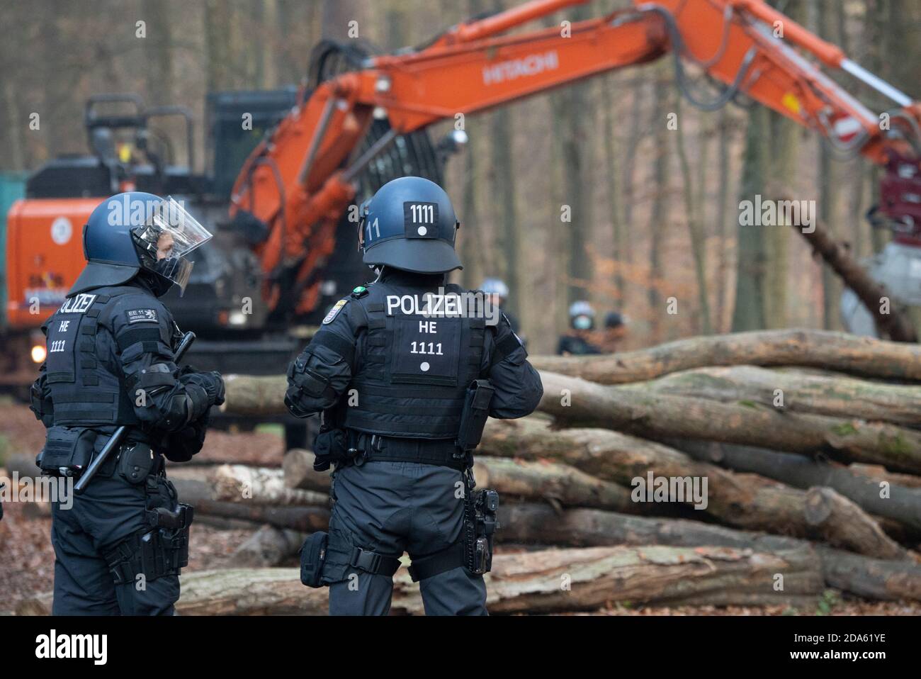 10 November 2020, Hessen, Niederklein: Two policemen are on duty at Dannenröder Forst. The officers are on the spot with several hundred men and special forces. Photo: Boris Roessler/dpa Stock Photo