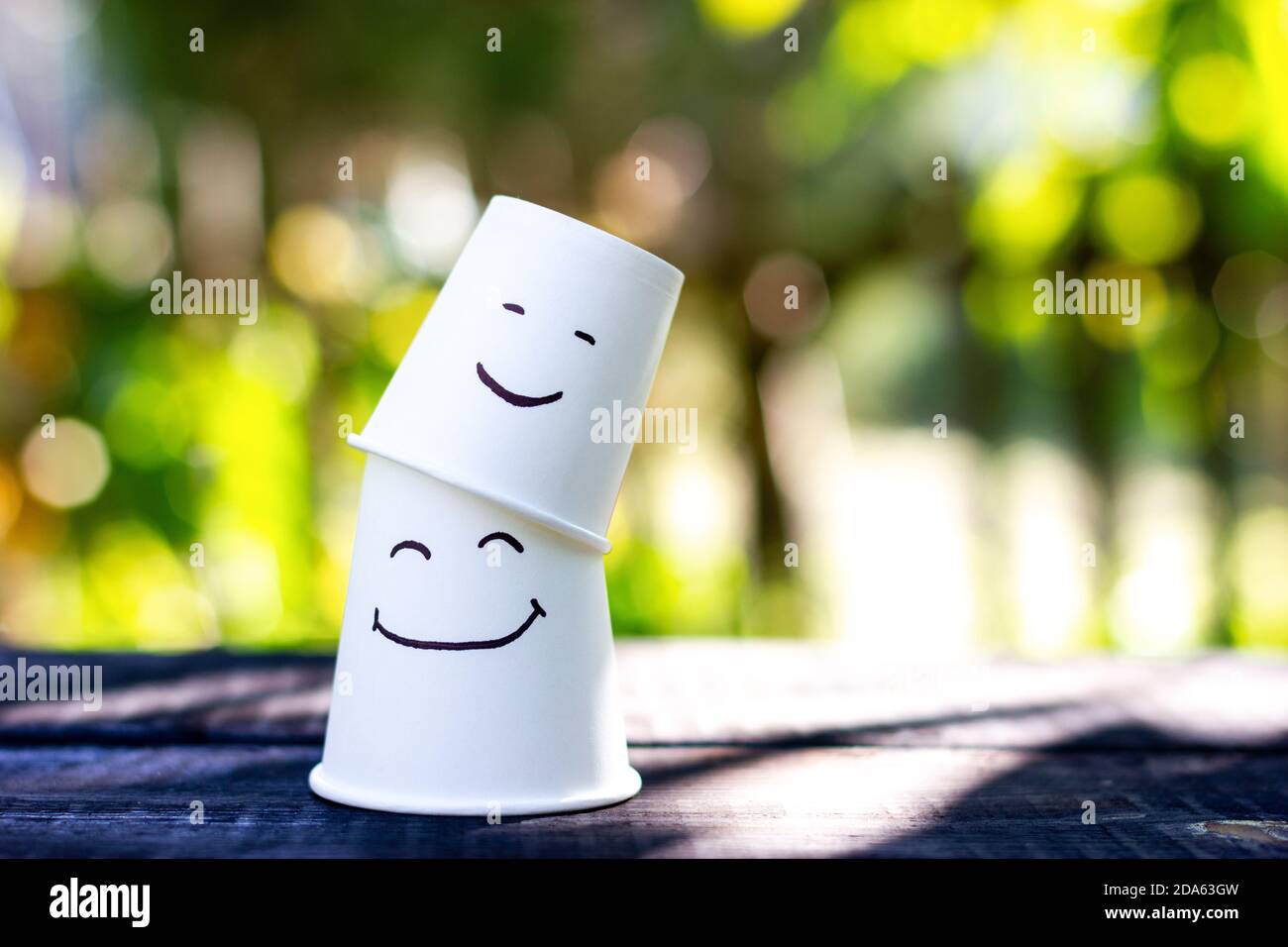 Two smiling cups. Emotion symbol of children and parents Stock Photo ...