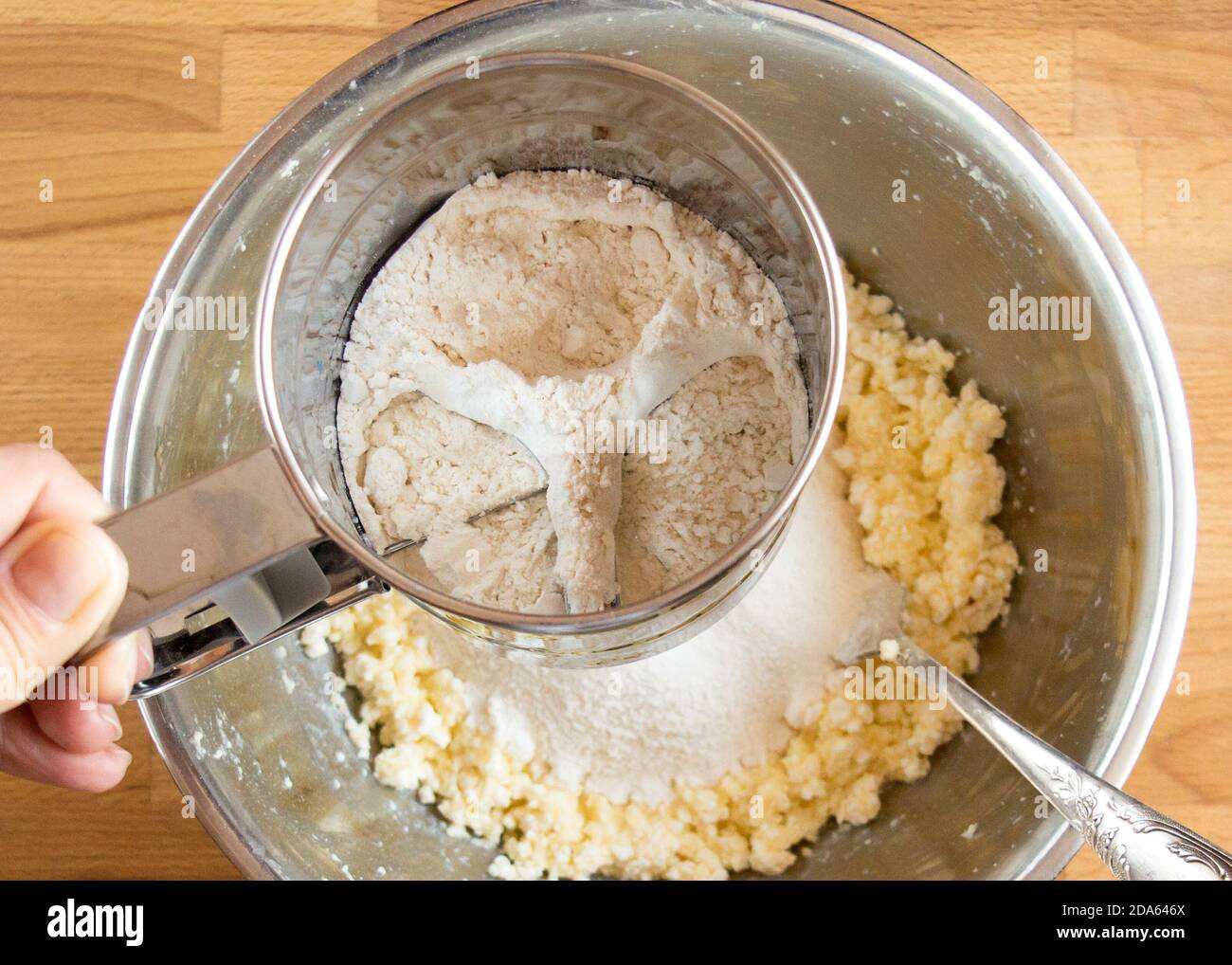 Sift flour dough bowl, top view into metal tool Stock Photo Alamy