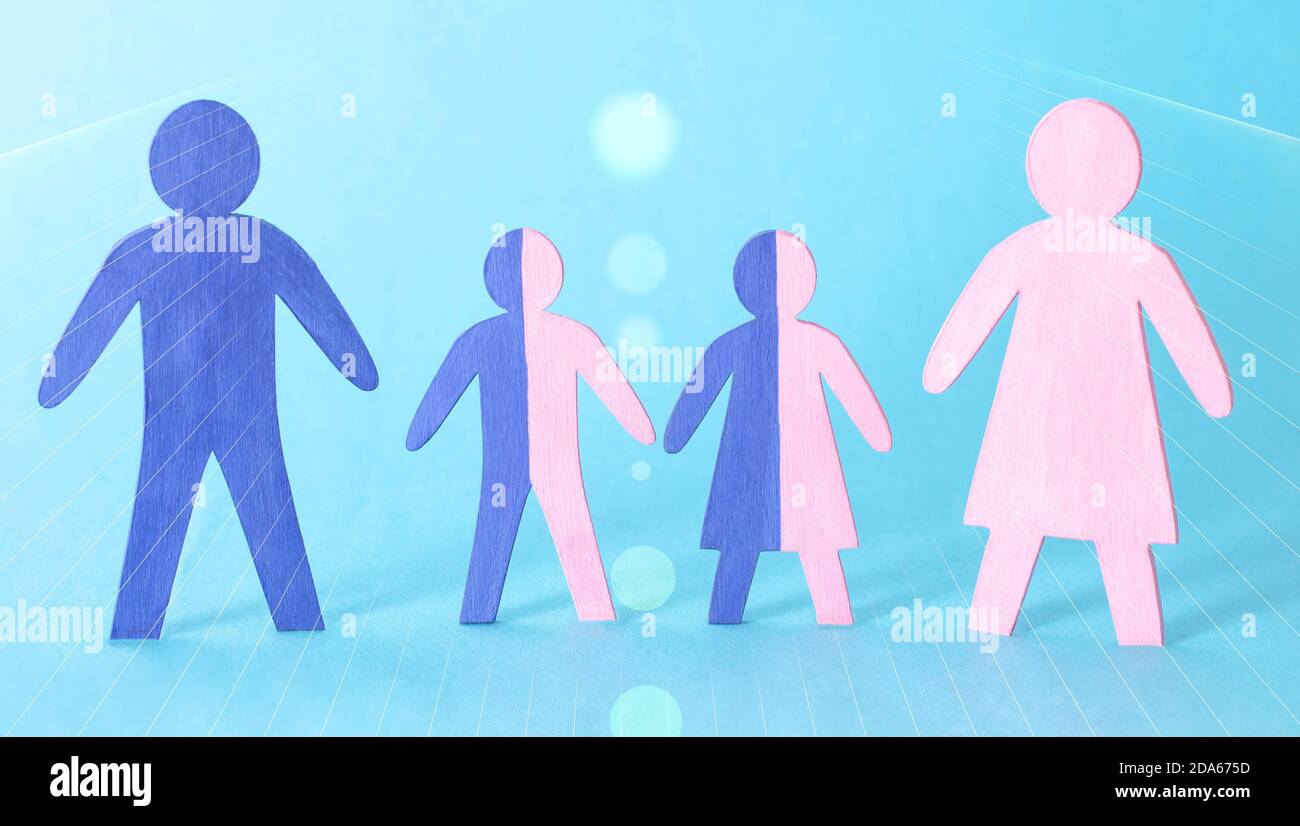 Wooden figures of people on a blue background. The concept of consanguinity in the family and close relatives. Illegitimate children, ancestor Stock Photo