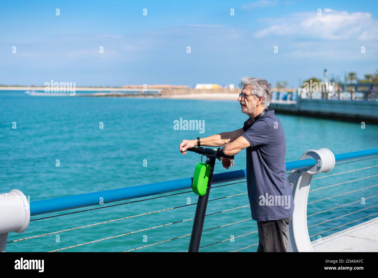 Man on electric scooter riding hi-res stock photography and images - Alamy