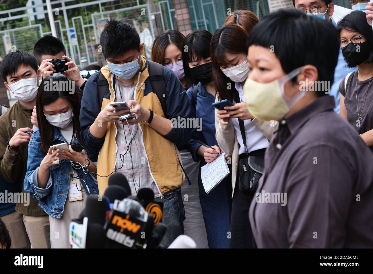 Members of the media wearing facemasks, listen as Bao Choy-yuk Ling, a freelance  journalist as she addresses them on her arrival at Fanling Magistrates'  Court for a hearing.Bao Choy-yuk Ling, a freelance