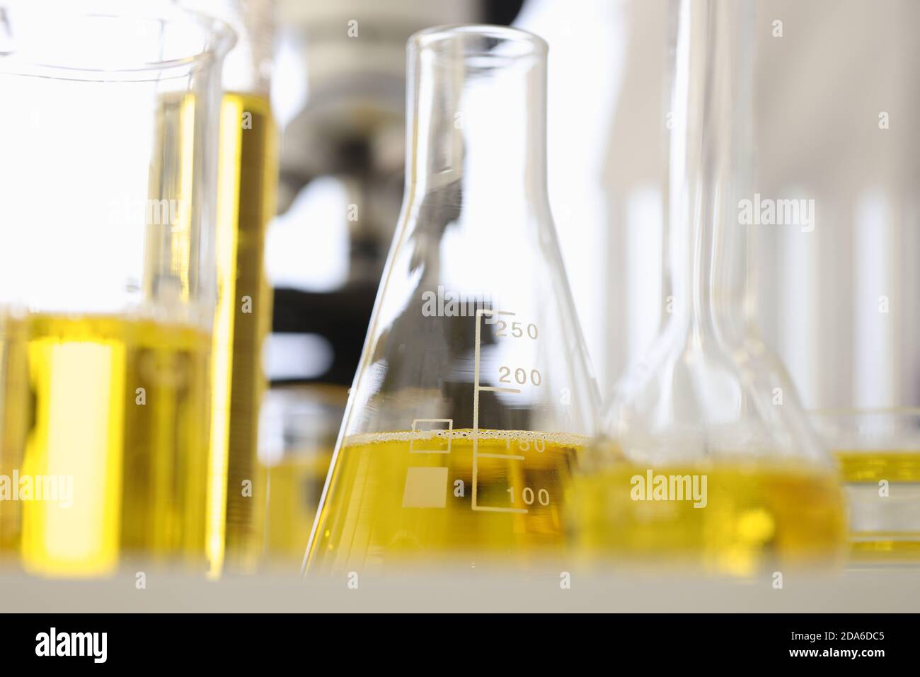 Flasks and test tubes contain yellow liquid Stock Photo Alamy