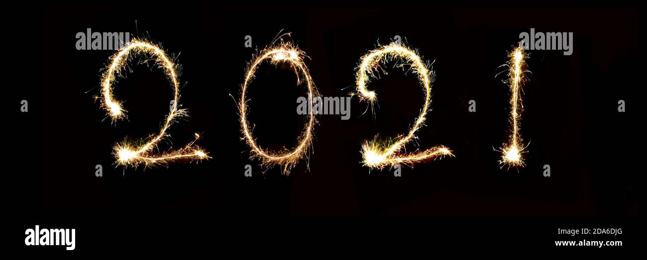 2021 written with sparkle firework, new year panoramic web banner Stock Photo