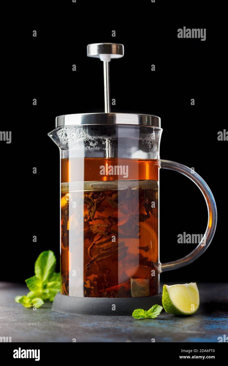 Teapot for brewing tea with the contents on a dark background Stock