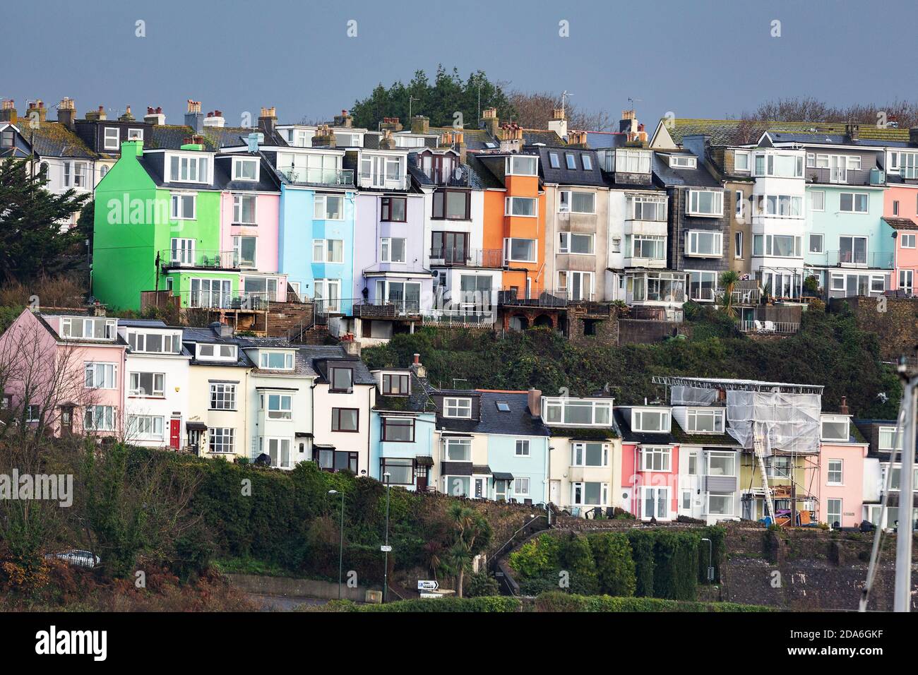 A row of colourful houses add a splash of colour on a drab day ! Stock Photo