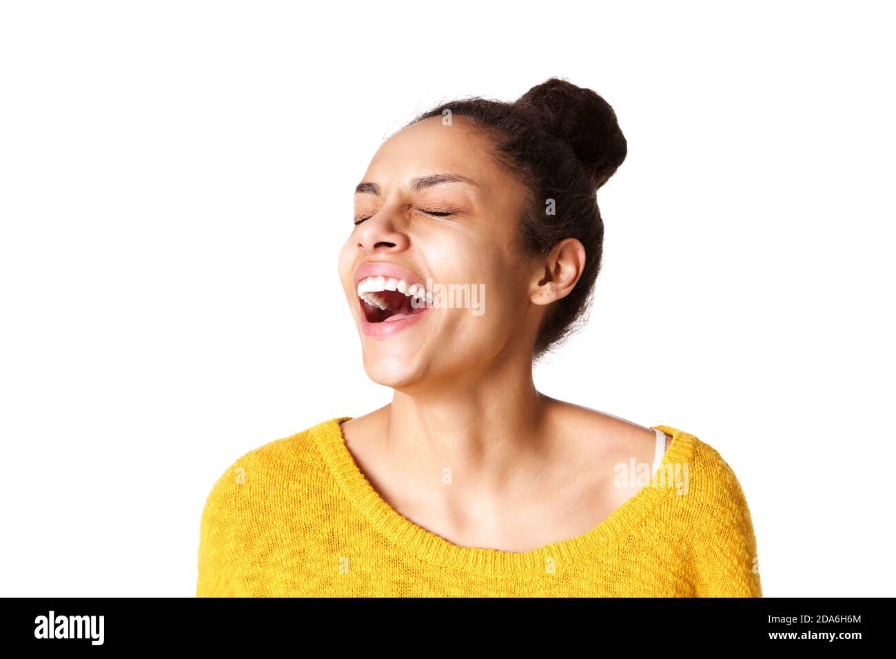 Close up portrait of excited young african woman laughing against white ...