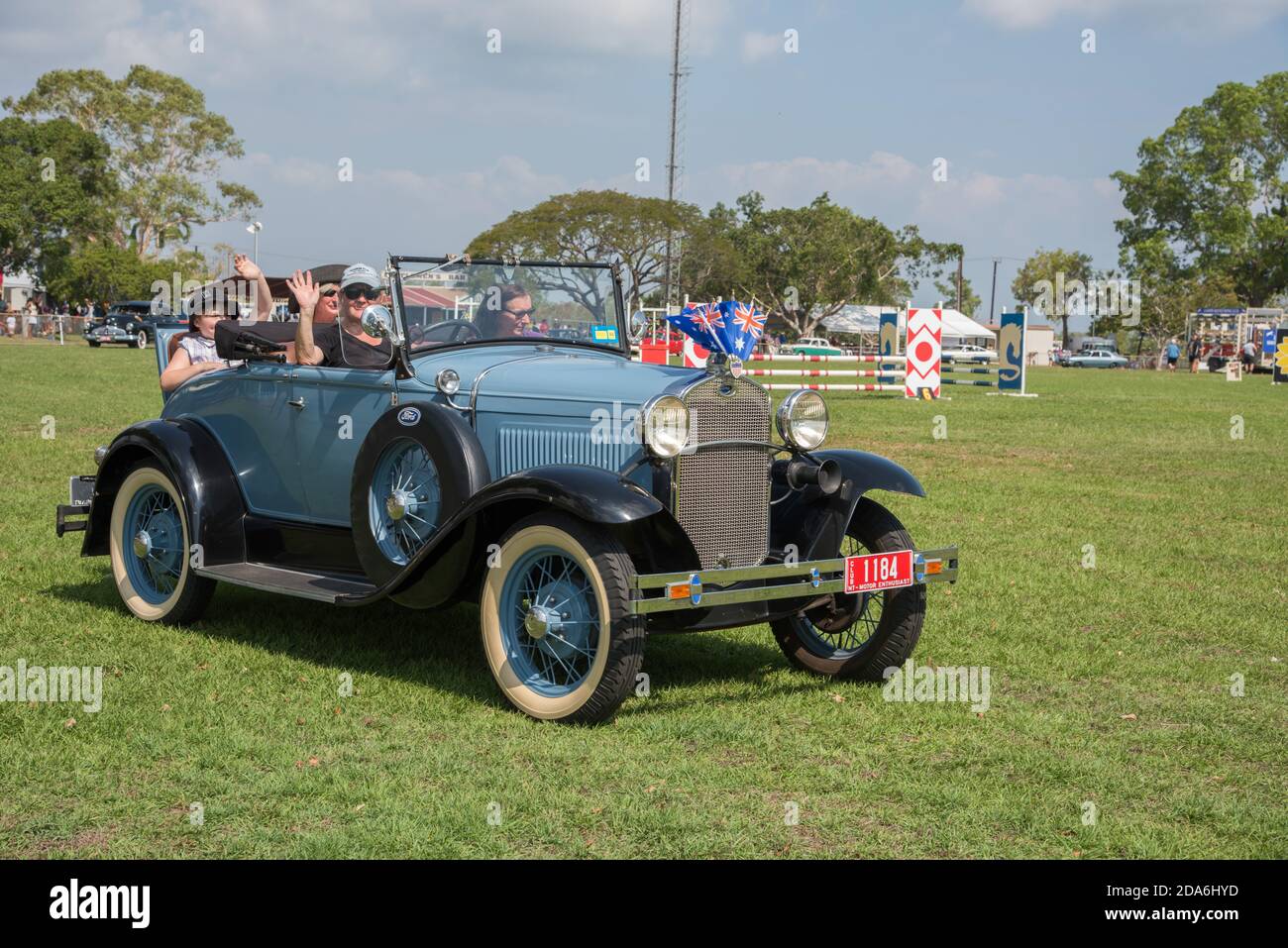 Darwin, NT, Australia-July 27,2018: People in vintage baby blue and black Ford convertible with flags parade at the Darwin Show in the NT of Australia Stock Photo