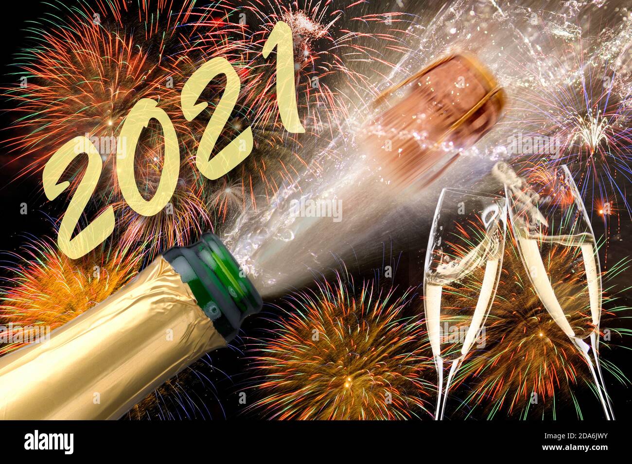 popping bottle of champagne with firework at silvester 2021 Stock ...