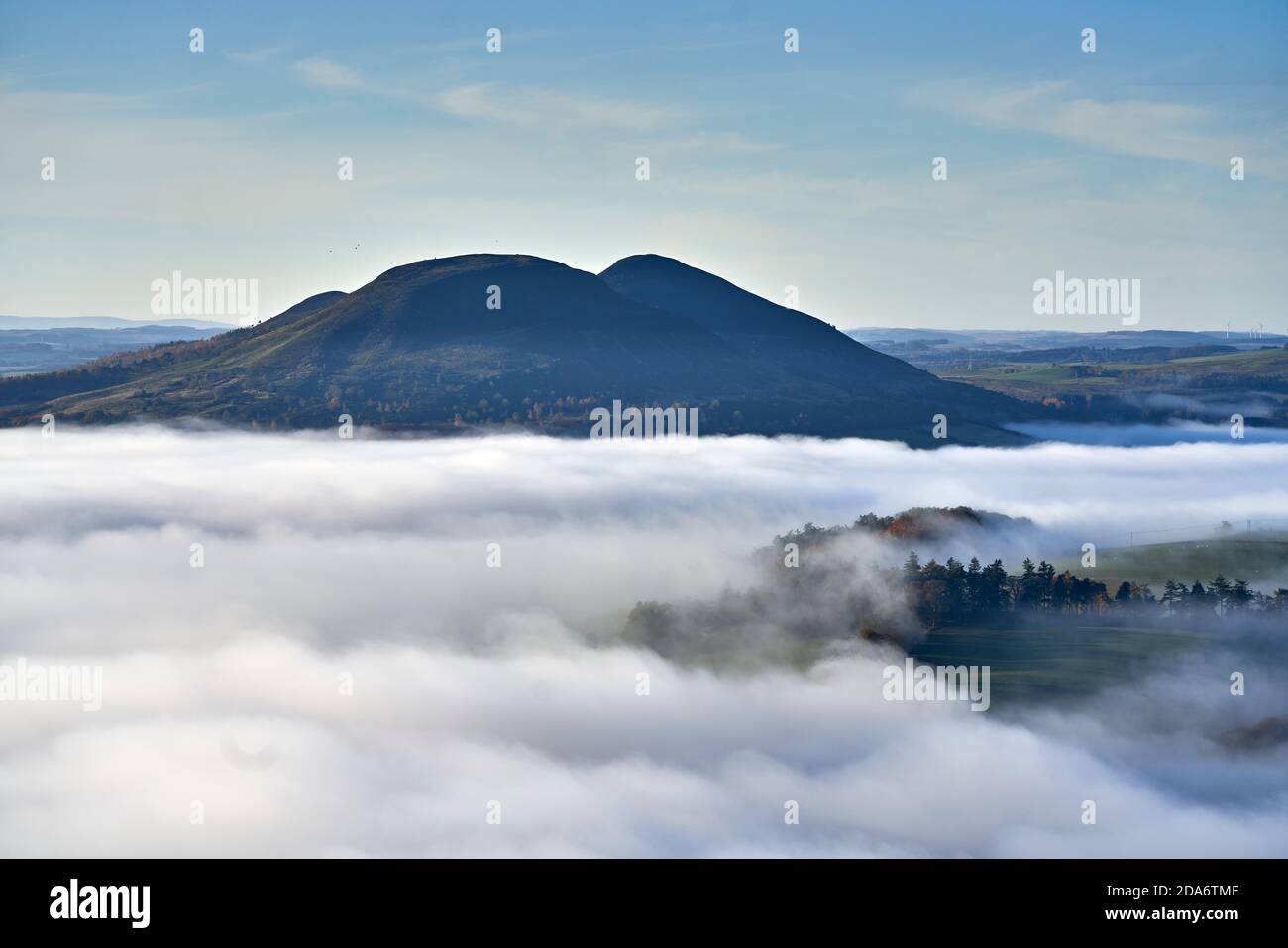 View of the Eildon Hill shrouded in autumn mist from the Black Hill in Earlston, Scottish Borders. Stock Photo