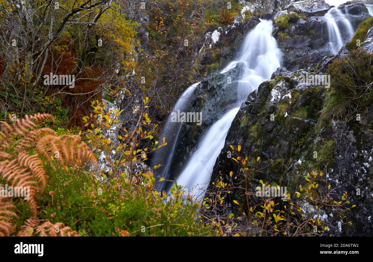 Beautiful waterfall with autumn colours in the Scottish Borders. Stock Photo