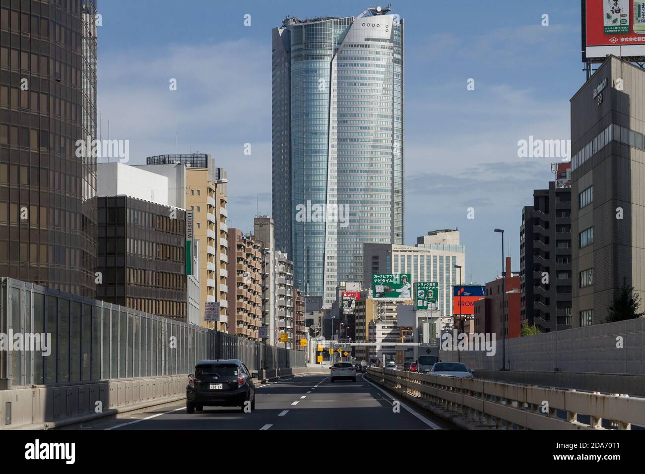 Roppongi Hills tower above an expressway. Roppongi, Tokyo, Japan, Sunday November 1st 2020 Stock Photo