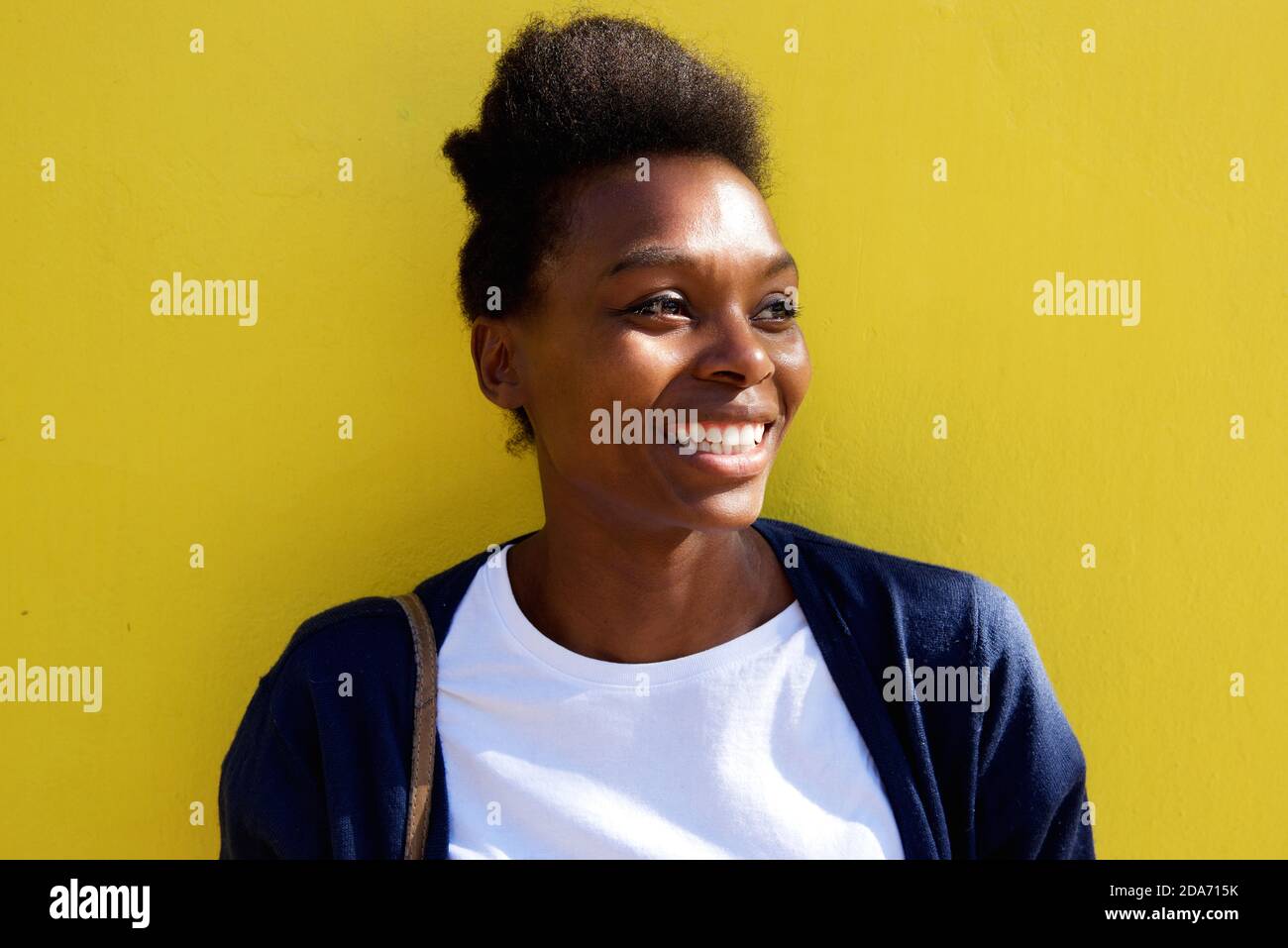 Close up portrait of beautiful young african woman looking away and ...