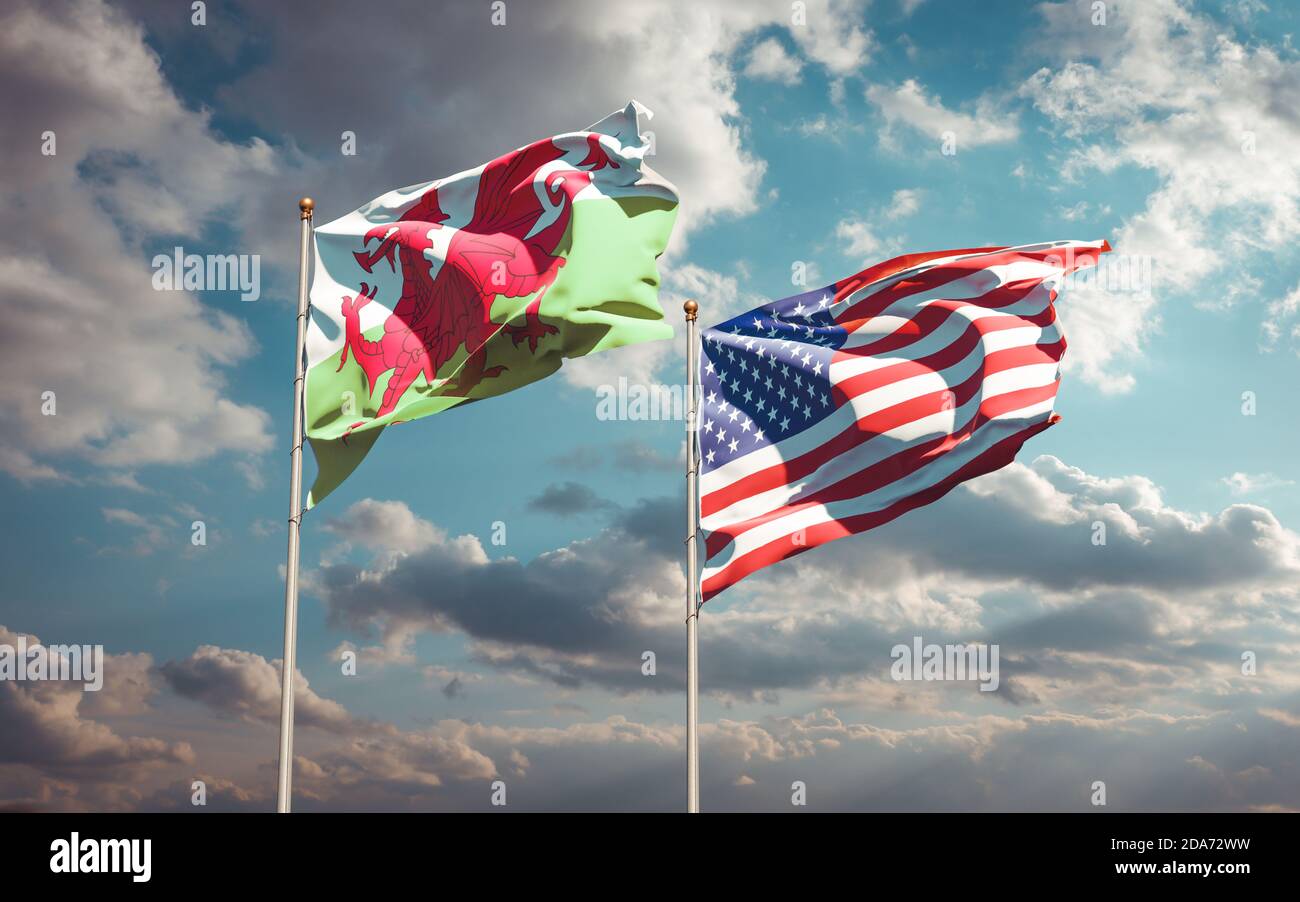 Beautiful national state flags of Wales and USA together at the sky ...