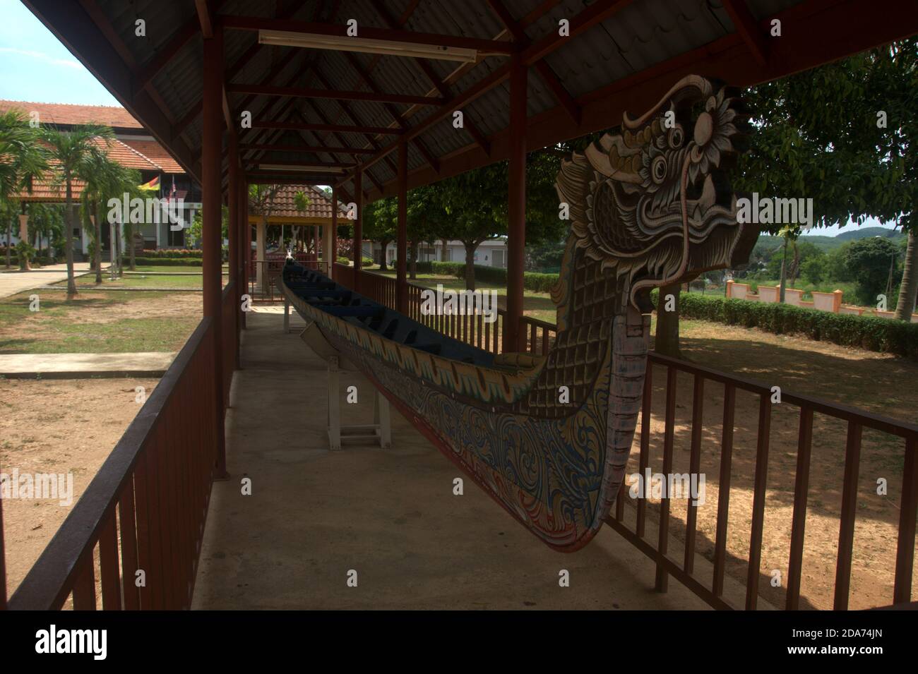 a traditional malay ethnic wooden dragon boat used for transportation and war in ancient time is displayed at Lukut Museum Port Dickson Malaysia Stock Photo