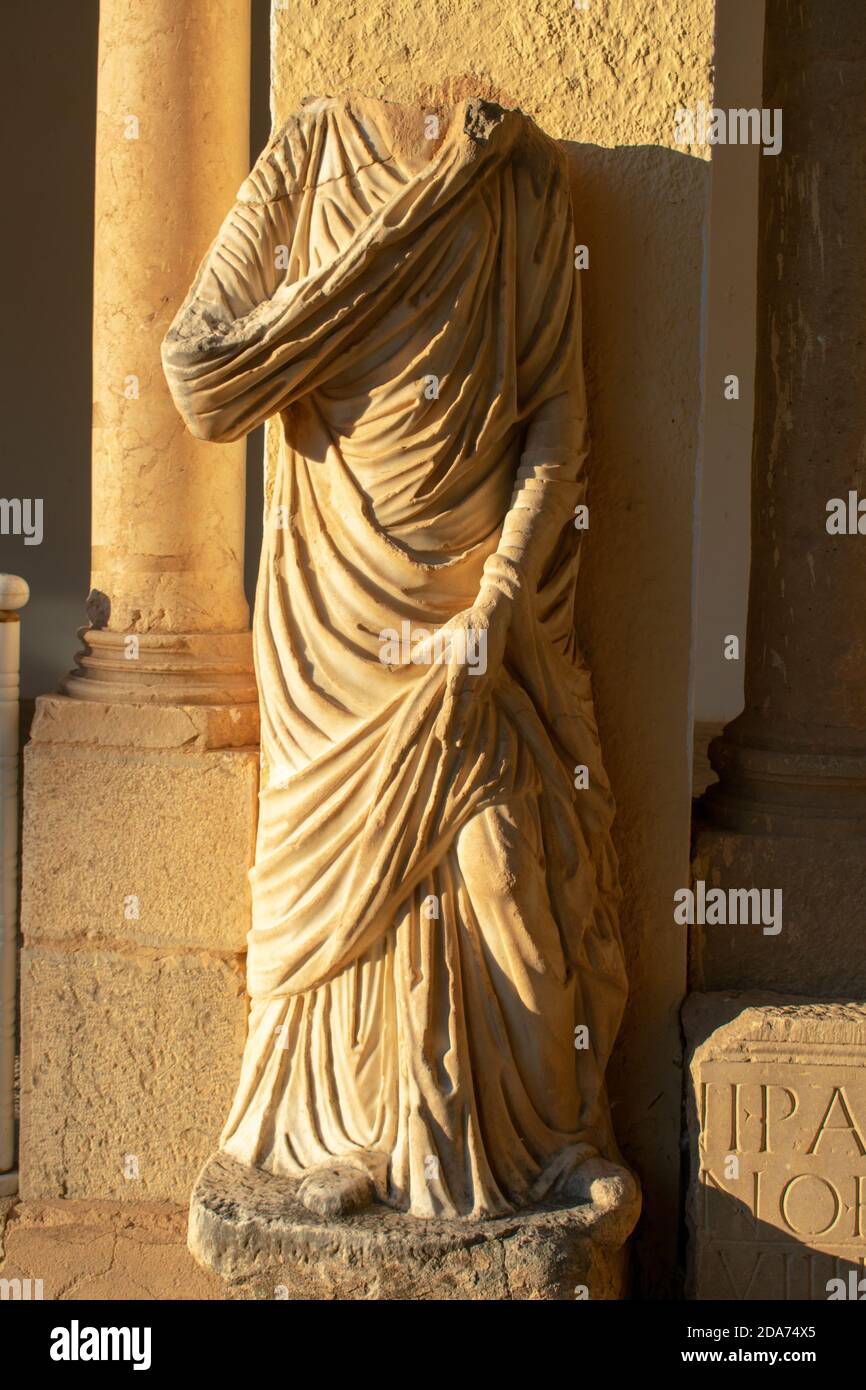 Vertical shot of a headless statue in the famous Roman ruins in Timgad, Algeria Stock Photo Alamy