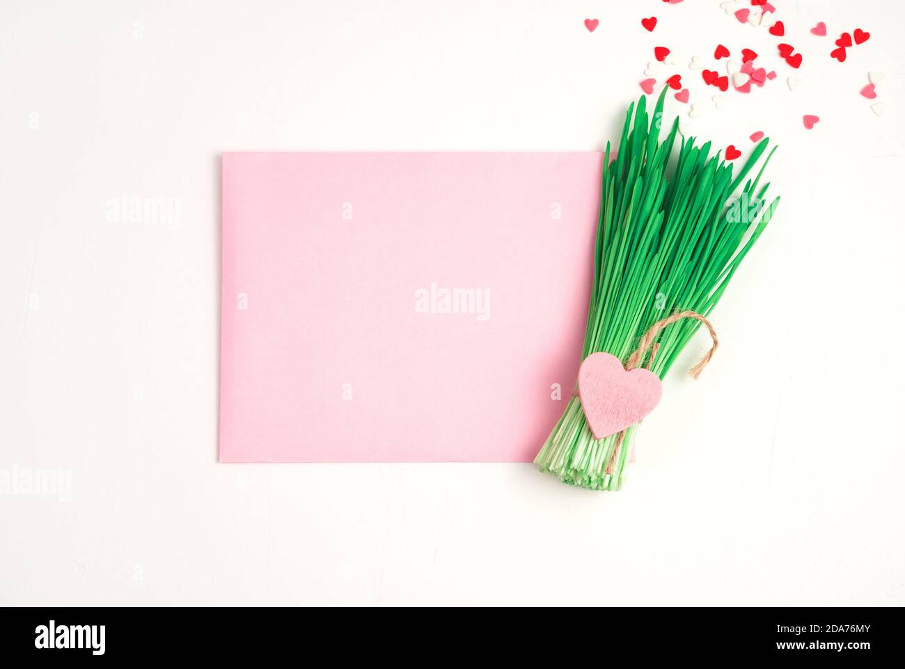 Holiday background with pink envelope and green envelope. Stock Photo