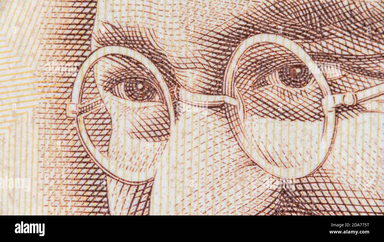 Close-up Indian Rupee banknotes. For India economy, Indian currency,  Gandhi. Old style 500 Rupee banknote. Gandhi spectacles / glasses. Stock Photo