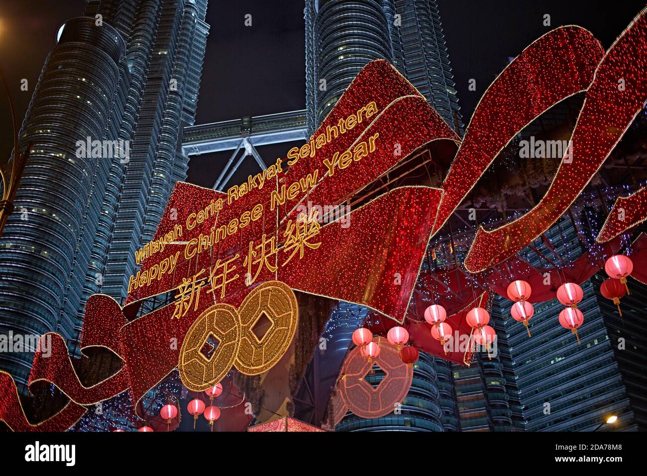 Kuala Lumpur, Malaysia, February 2016. Chinese New Year's luminous sign in front of the Petronas towers illuminated at night. Stock Photo