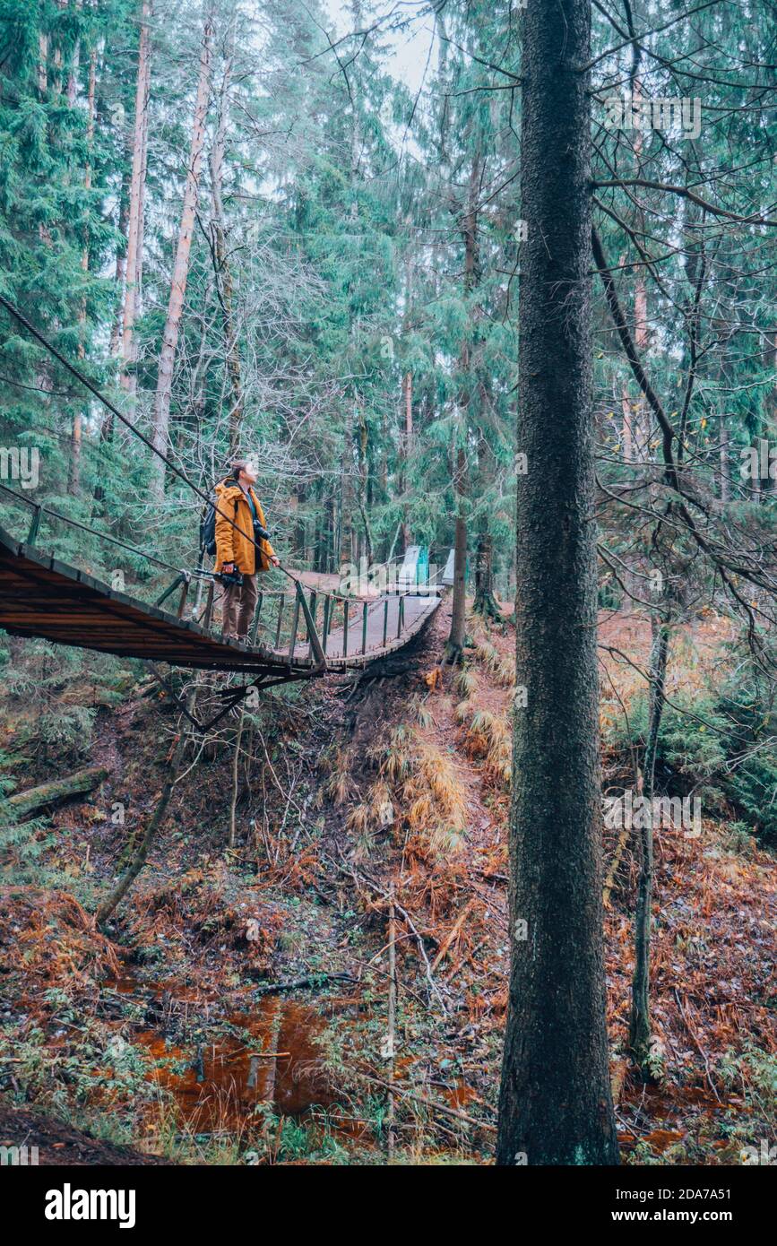 Man walking suspension bridge hi-res stock photography and images - Alamy