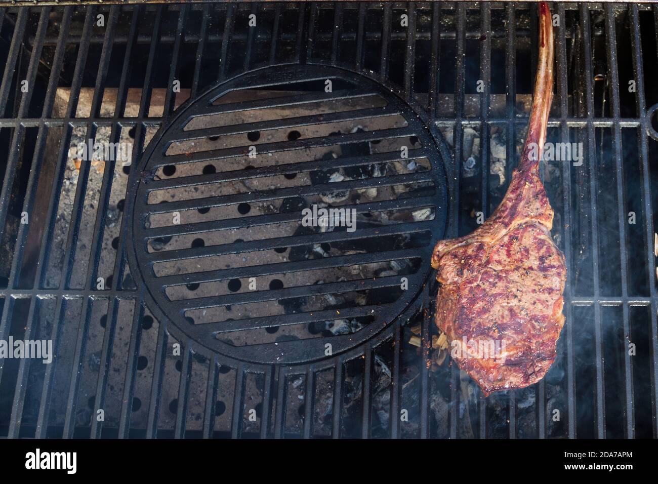 Dry Aged Barbecue Tomahawk Steak on grill Stock Photo