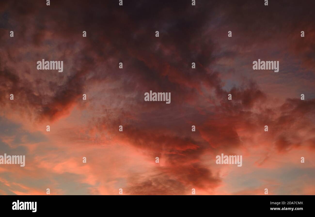 Beautiful multi colored moody sunset view. Full frame cloudy sky background Stock Photo