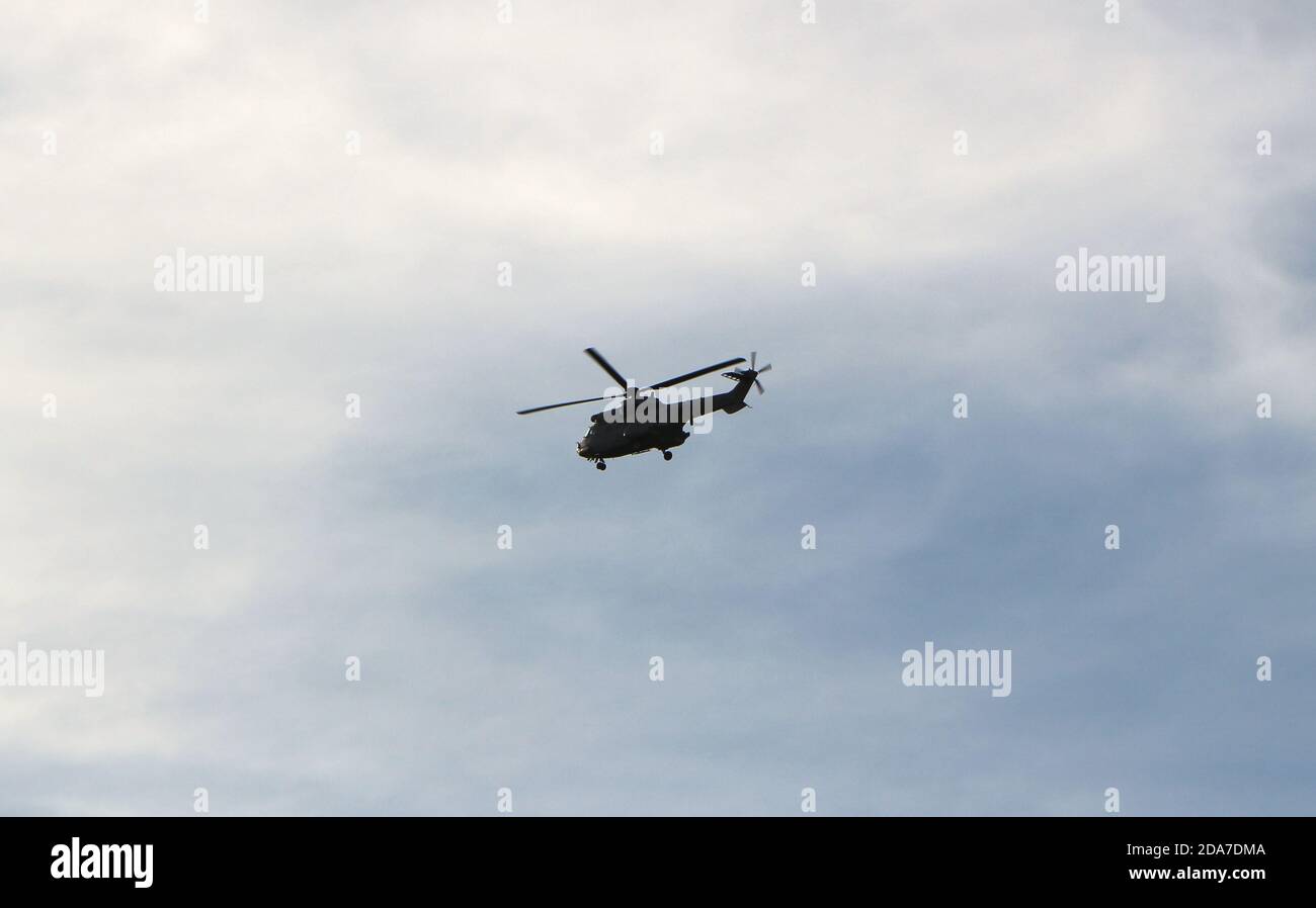 Grey Airbus Super Puma H215 Search and Rescue helicopter flying along the  coast near Santander Cantabria Spain afternoon with high cloud Stock Photo  - Alamy