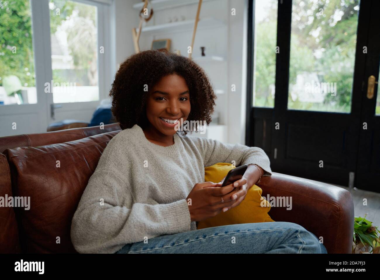 Cheerful african woman hi-res stock photography and images - Alamy