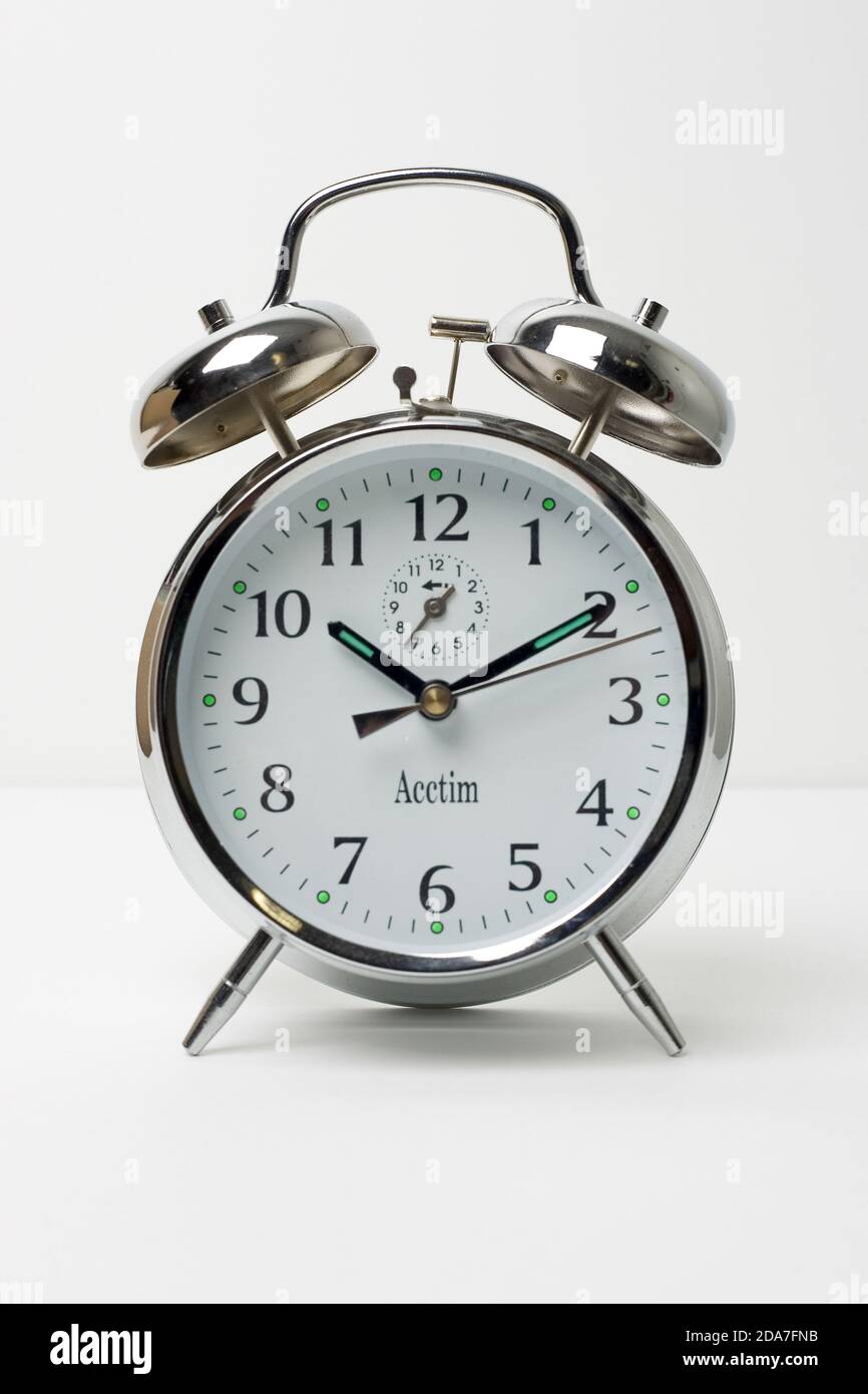 Traditional chrome surround alarm clock with bells and white face still