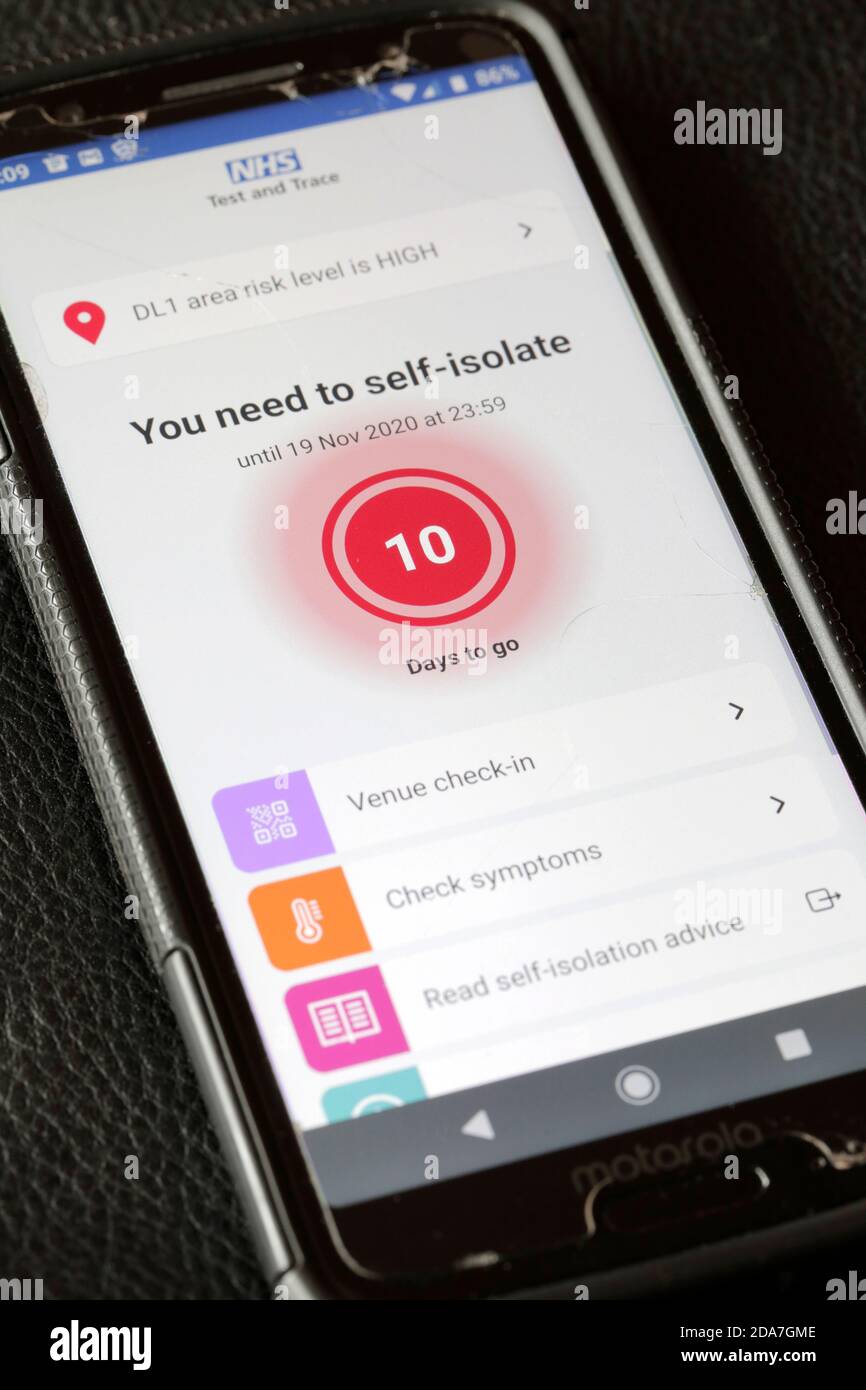 The NHS Test and Trace app flashing up a self-isolate warning on a smartphone. 10/11/2020. Photograph: Stuart Boulton. Stock Photo