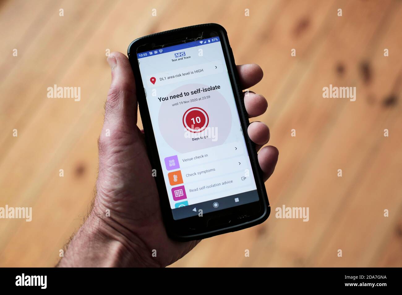 The NHS Test and Trace app flashing up a self-isolate warning on a smartphone. 10/11/2020. Photograph: Stuart Boulton. Stock Photo