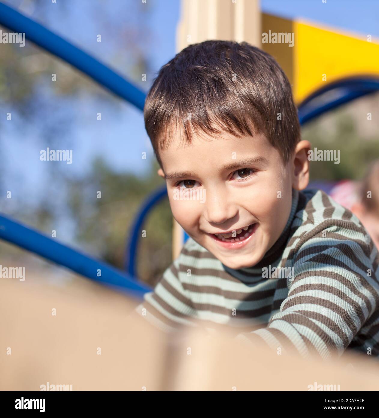 Cute boy playing on the playground Stock Photo - Alamy
