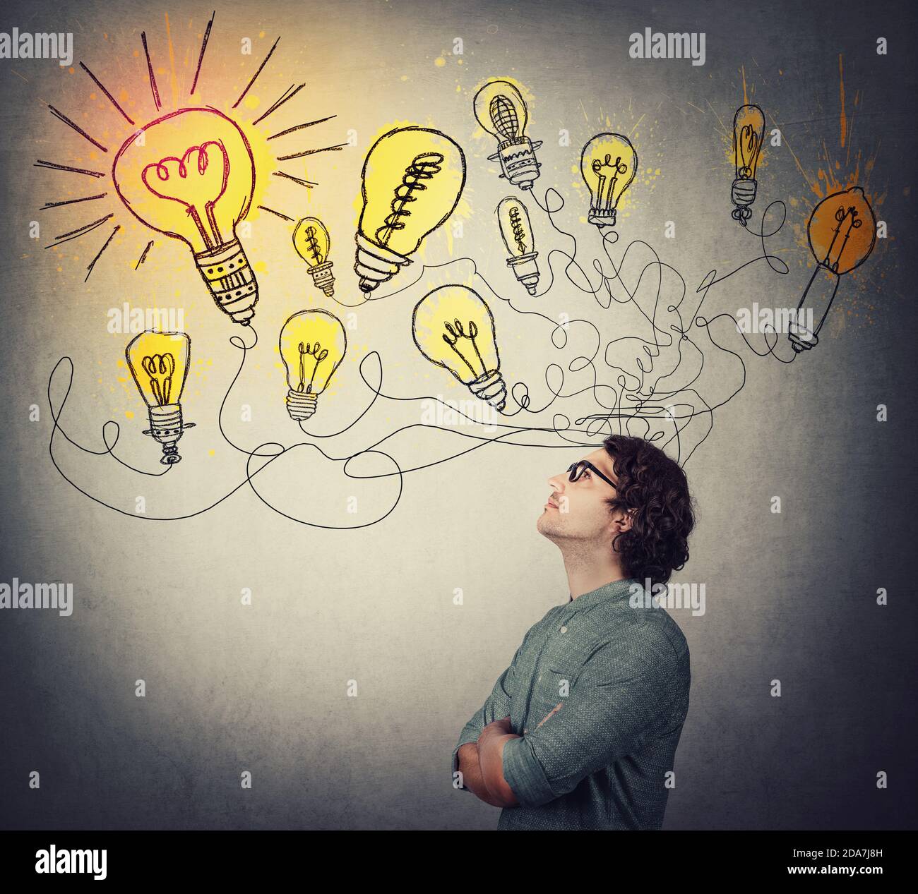 https://c8.alamy.com/comp/2DA7J8H/creative-businessman-thinking-of-great-ideas-looking-at-bright-lightbulbs-on-the-wall-business-worker-search-for-solutions-to-solve-the-problems-g-2DA7J8H.jpg