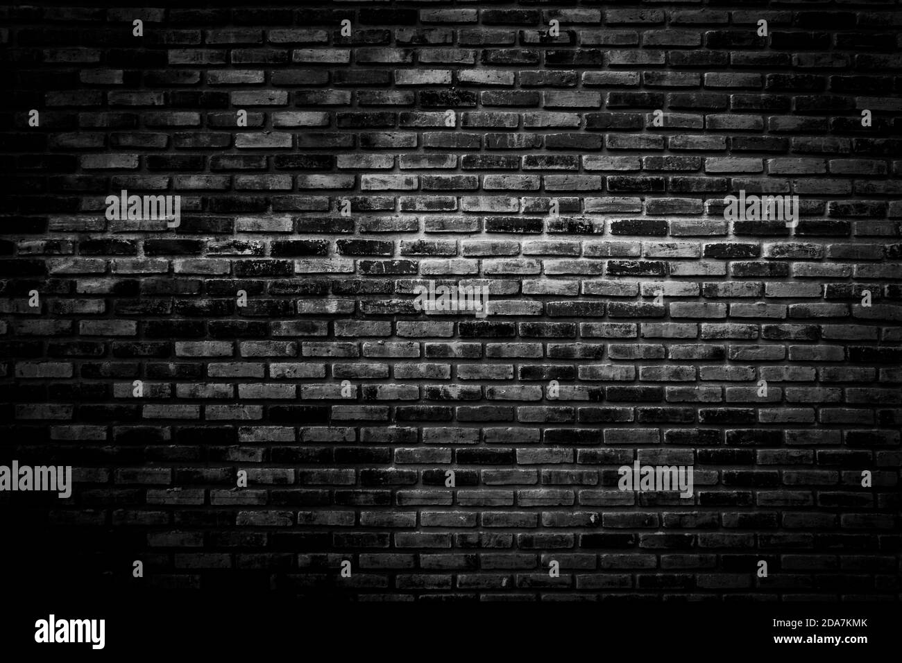 Black brick walls that are not plastered background and texture. The