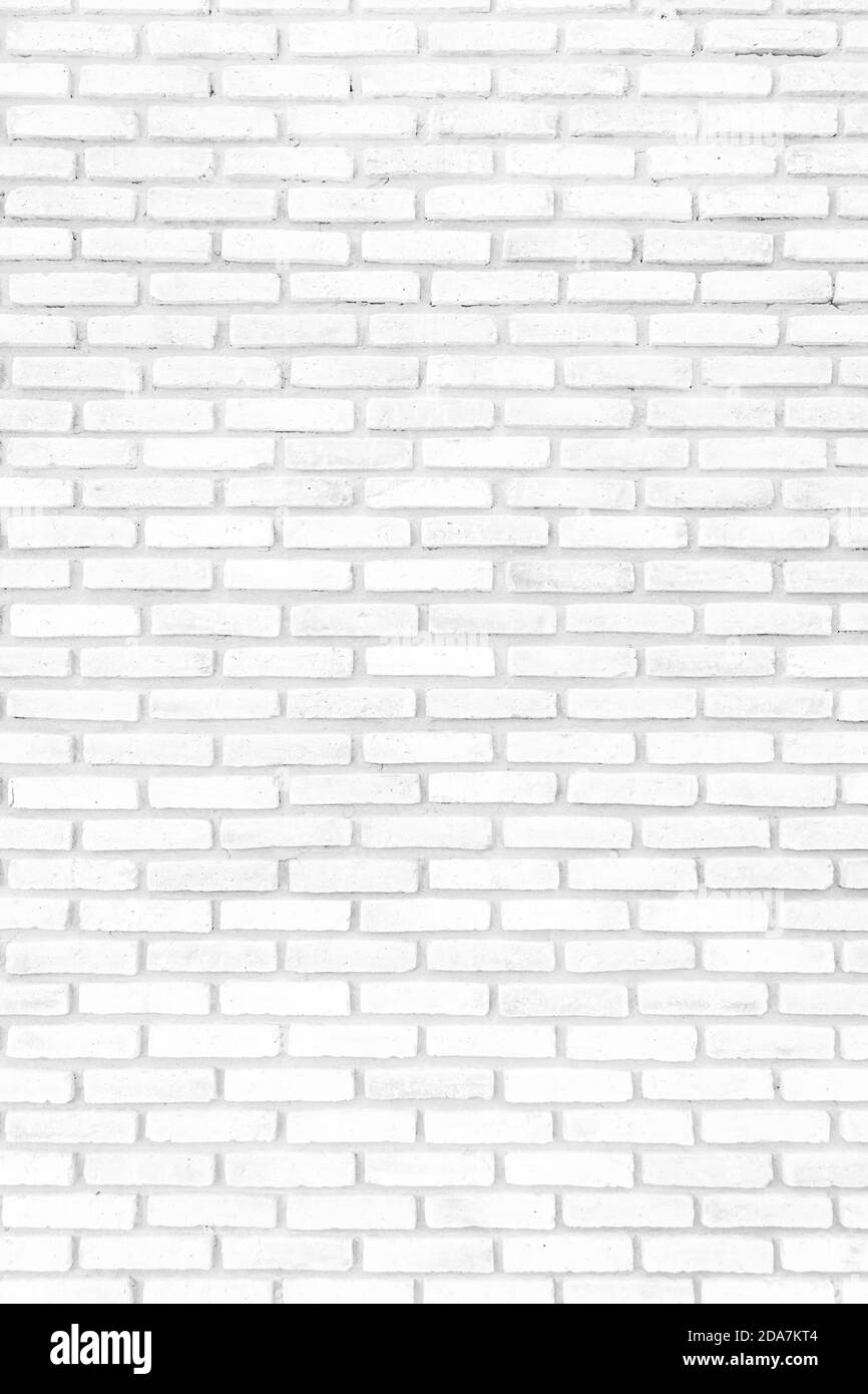 White brick walls that are not plastered background and texture. The texture of the brick is white. Background of empty white tile ceramic wall. Stock Photo