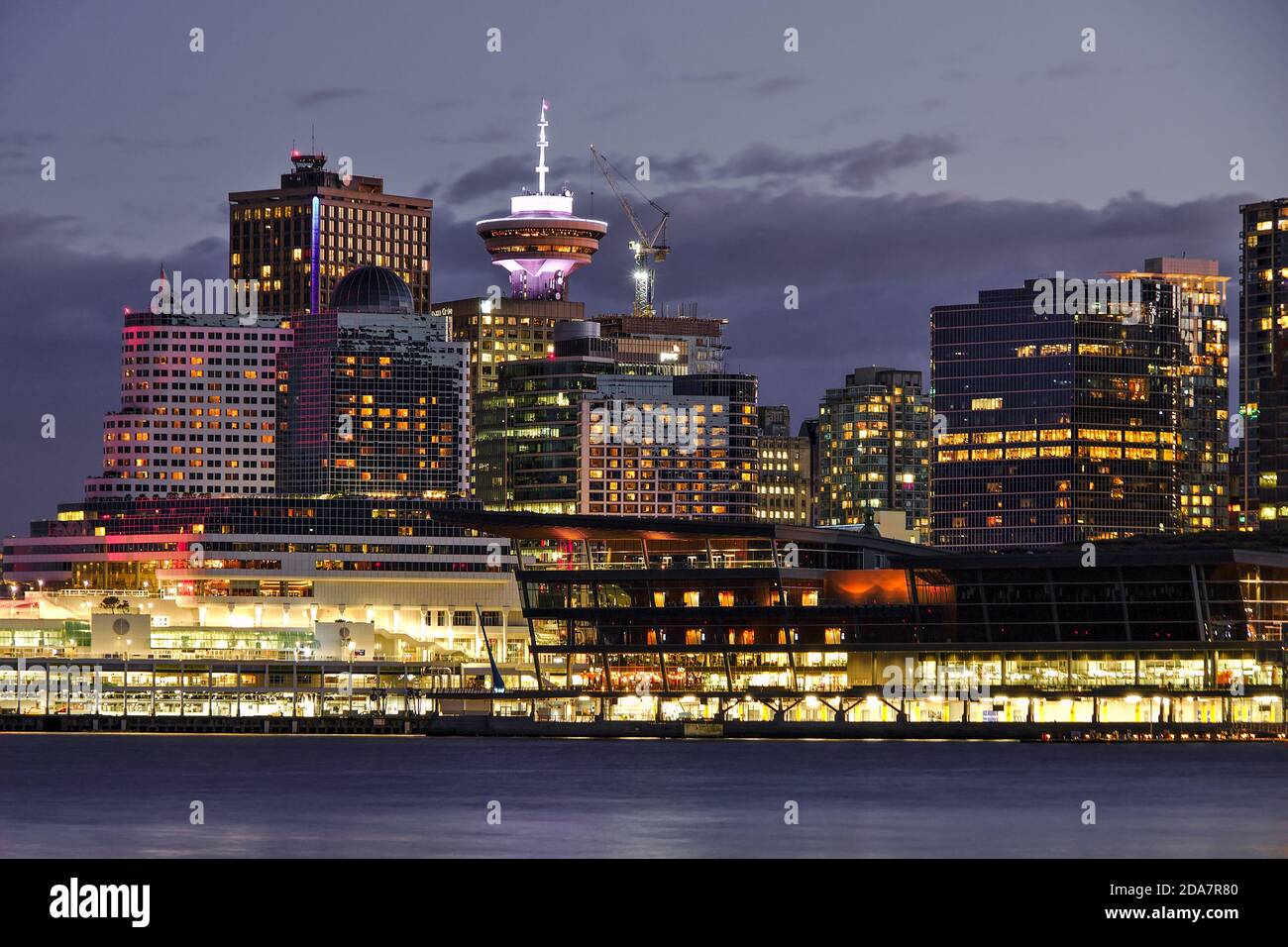 Vancouver Downtown cityscape during sunset, orange city lights, British Columbia, Canada Stock Photo