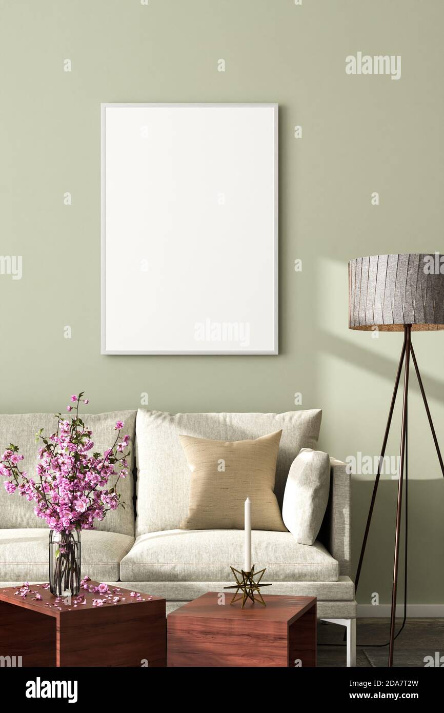 Interior scene: living room with a sofa in a loft building. Floor lamp, coffee table, candle holder and vase with cherry blossoms. Empty picture frame Stock Photo