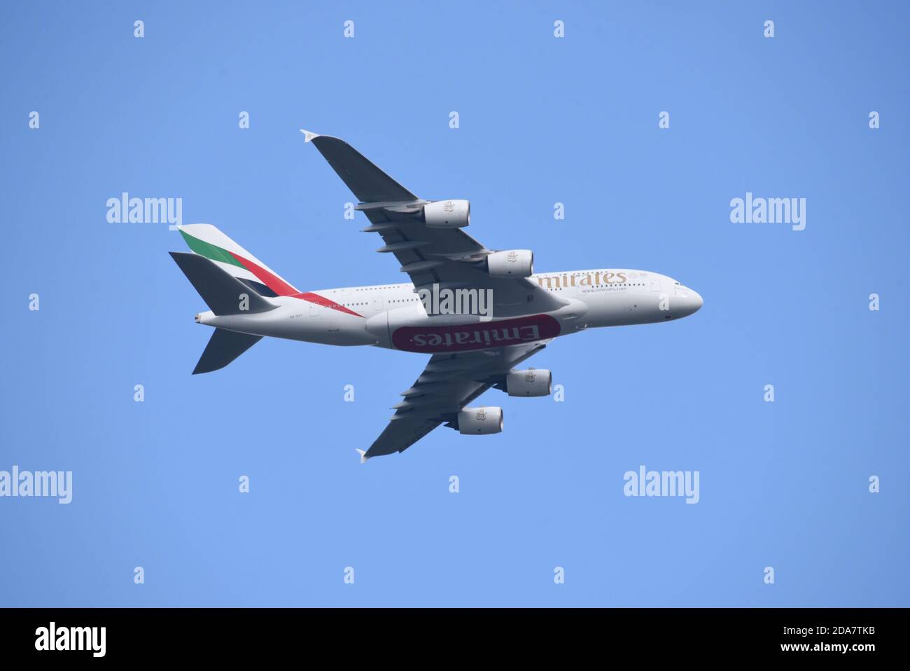 An Emirates A380 against a clear blue sky shortly after leaving London's Heathrow airport Stock Photo