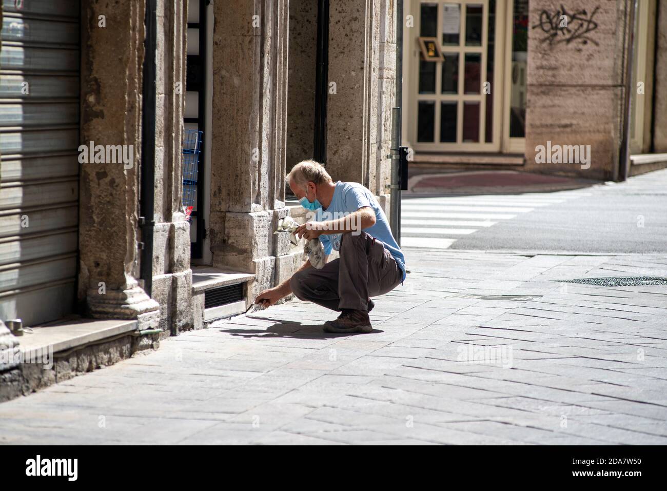 terni,italy september 02 2020:house painter at work on a shop Stock Photo
