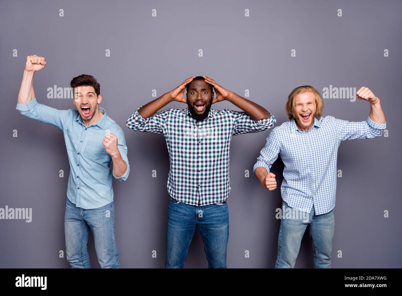 Portrait of ecstatic crazy group man fellows watch world cup league support national team victory raise fists scream yes wear checkered plaid shirt Stock Photo