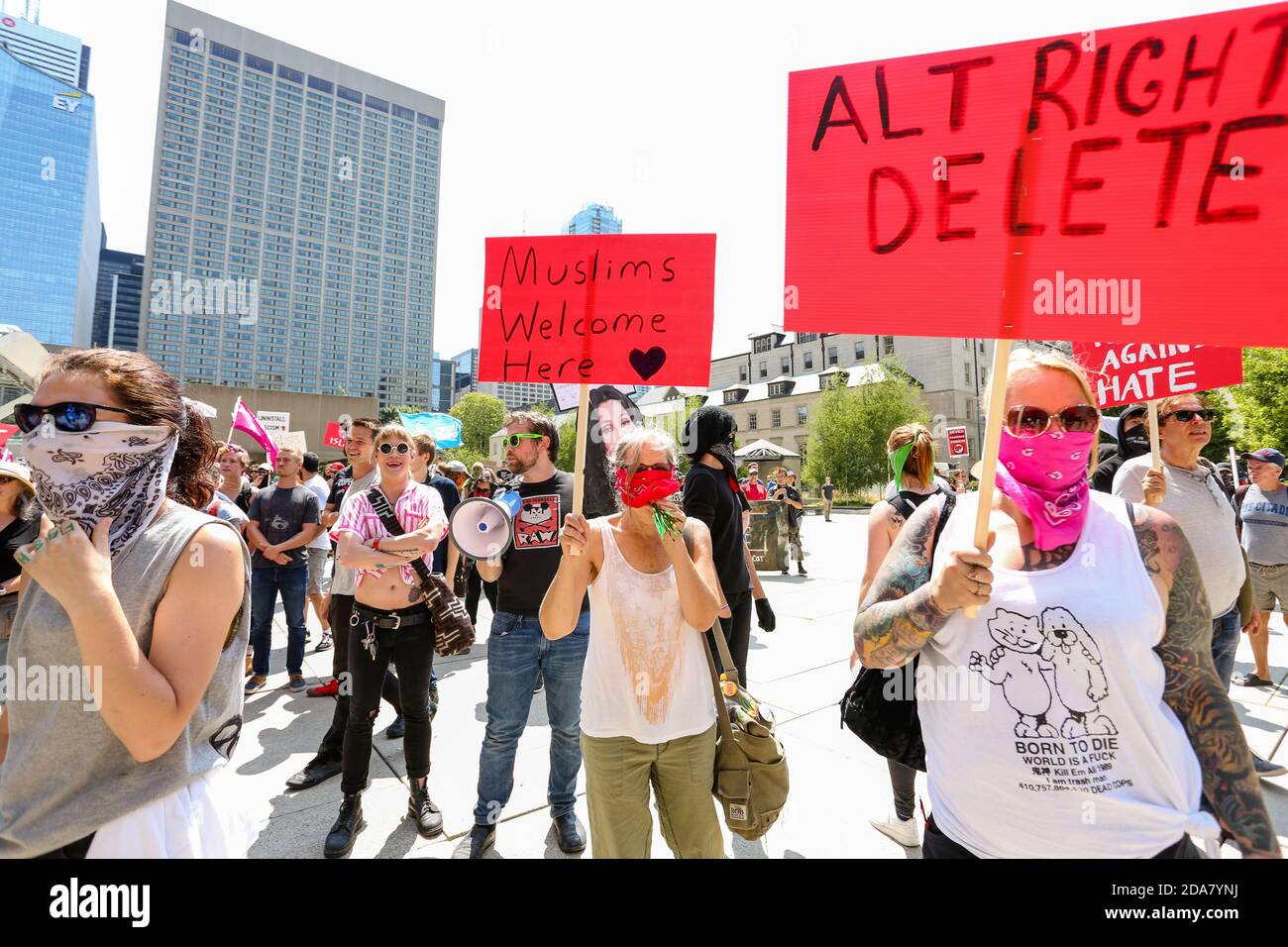 Protesters holding placards saying 'Alt right delete' and 'Muslims welcome here' during the demonstration.A 'Stop the Hate' rally was held by ANTIFA (Anti-Fascist) protesters at Nathan Phillip Square in opposition to WCAI (Worldwide Coalition Against Islam) Canada, a group that planed a protest on the same day. Stock Photo