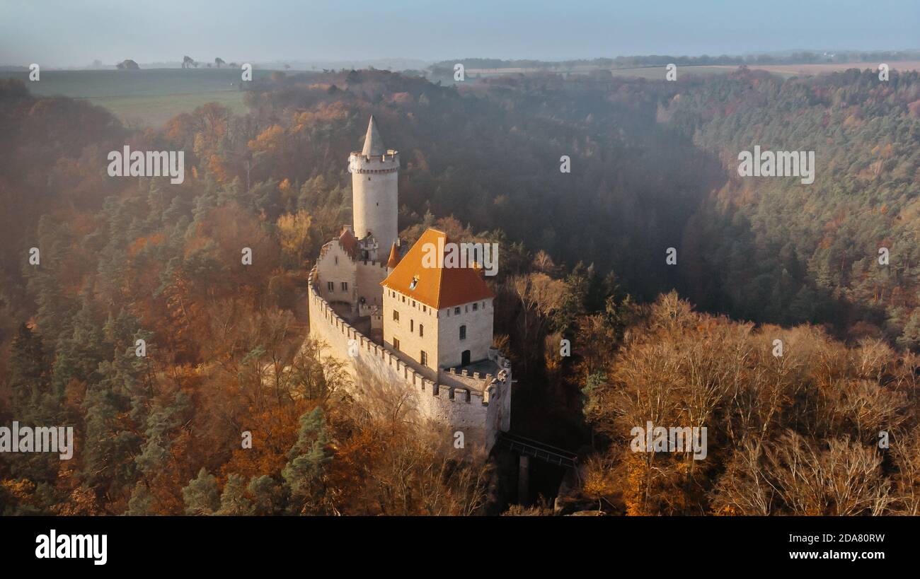 Aerial fall view of old stone Kokorin Castle built in 14th century.It lies in the middle of nature reserve on a steep rocky spur above the Kokorin Stock Photo