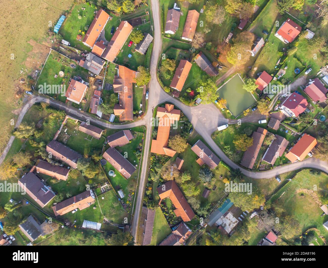 Aerial view of a small village.Top view of traditional housing estate in Czech. Looking straight down with a satellite image style.Houses from above Stock Photo